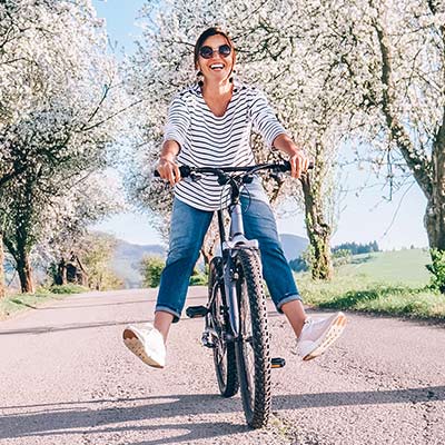 A woman on a bike in the Spring